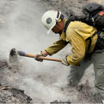 A firefighter works to extinguish the Cedar Creek Fire in the Willamette National Forest near Oakridge, Ore., in 2022. The fire burned near Waldo Lake, where there are areas designated as an inventoried roadless area by the U.S. Forest Service. (U.S. Forest Service)