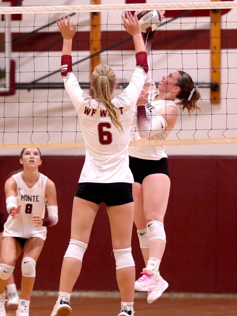 PHOTO BY HAILEY BLANCAS Montesano outside hitter Grace Gooding (right) attempts a kill during a straight-set victory over W.F. West on Wednesday in Chehalis.