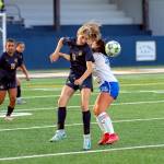 PHOTO BY MIKE ROBERTS Aberdeen midfielder Kennedy Kolodzie (left) gets her head to the ball during a 2-1 victory over Elma on Thursday in Aberdeen.