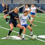 PHOTO BY MIKE ROBERTS Aberdeens Shay Dunlap (left) attempts to jar the ball loose from Elmas Chelsea Plata during the Bobcats 2-1 win on Thursday at Stewart Field in Aberdeen.