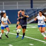 PHOTO BY MIKE ROBERTS Aberdeens Miley Anderson (17) plays keep-away with Elmas Zippy Valentine (left) and Maddie Barrera during the Bobcats 2-1 win on Thursday at Stewart Field in Aberdeen.