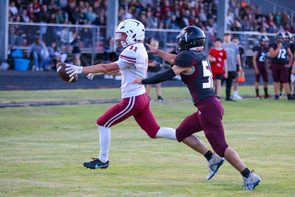 PHOTO BY LARRY BALE Hoquiam receiver Ethan Byron scores a touchdown during a 31-7 victory over Raymond-South Bend on Friday at Raymond High School.