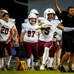 PHOTO BY MATT RUMBLES Hoquiam running back Kingston Case (5) is cheered on by his team during a 31-7 win over Raymond-South Bend on Friday at Raymond High School.