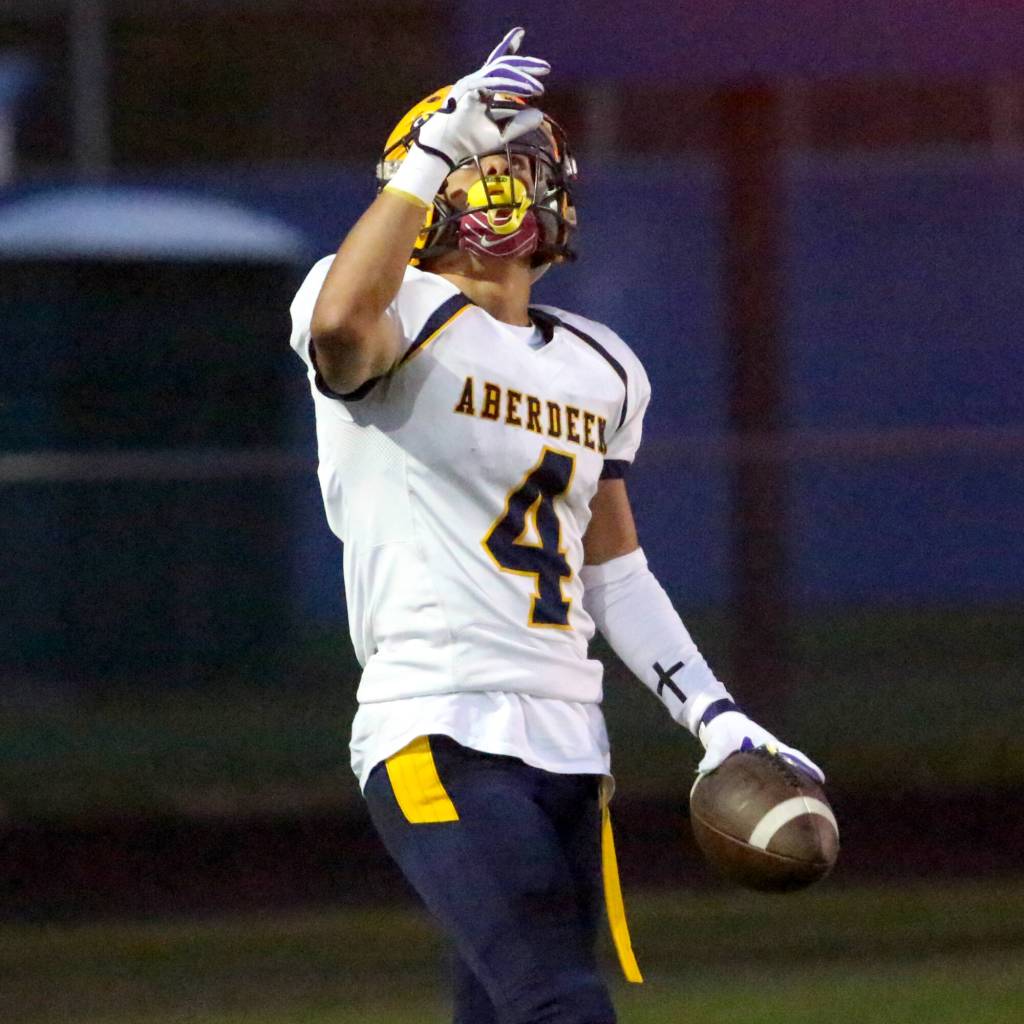 RYAN SPARKS | THE DAILY WORLD Aberdeen receiver Adonis Hammonds (4) points up to the sky after scoring a touchdown during a 35-20 win over Rochester on Saturday at Rochester High School.