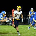 RYAN SPARKS | THE DAILY WORLD Aberdeen running back Micah Schroeder sprints away from the Rochester defense for a game-clinching touchdown to secure a 35-20 victory over Rochester on Saturday at Rochester High School.