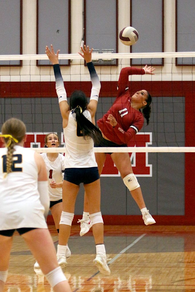 RYAN SPARKS | THE DAILY WORLD Hoquiams Aaliyah Kennedy (11) records a kill while defended by Aberdeen Mia Hallak during the Grizzlies 3-2 loss on Thursday at Hoquiam High School.