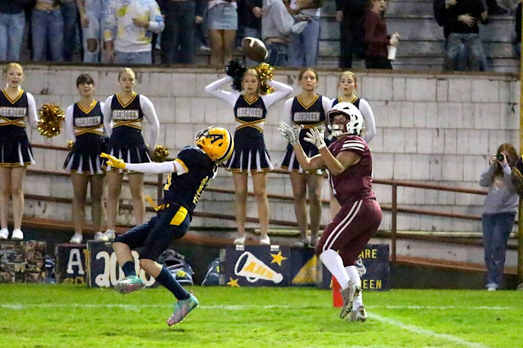RYAN SPARKS | THE DAILY WORLD Hoquiam tight end Lincoln Niemi (right) hauls in a touchdown pass while defended by Aberdeen defensive back Brody Sherman during Aberdeens 43-7 win in the 120th Myrtle Street Rivalry on Friday at Olympic Stadium in Hoquiam.