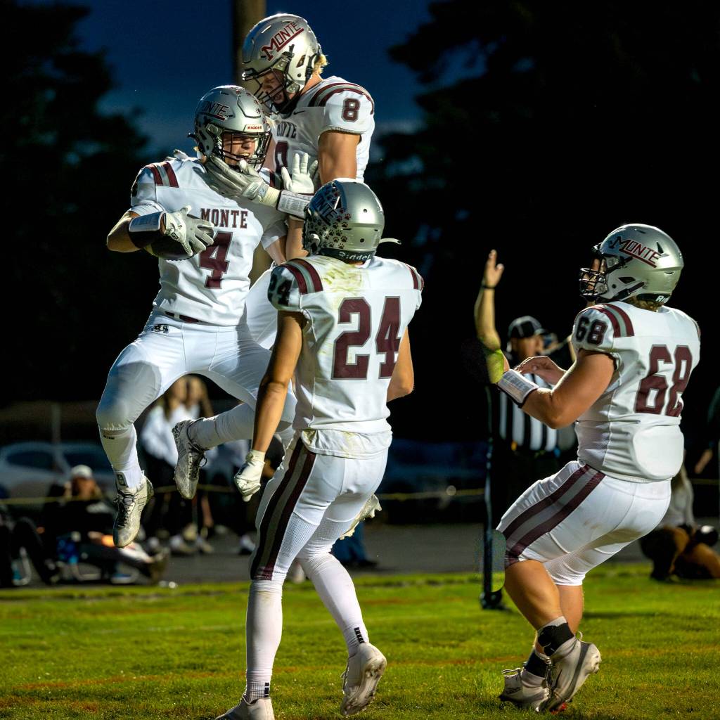 PHOTO BY FOREST WORGUM Montesanos Mason Fry (8), Kole Kjesbu (24) and Kyle Caton (68) celebrate a touchdown by teammate Zach Timmons (4) during a 56-0 victory on Friday at Napavine High School.
