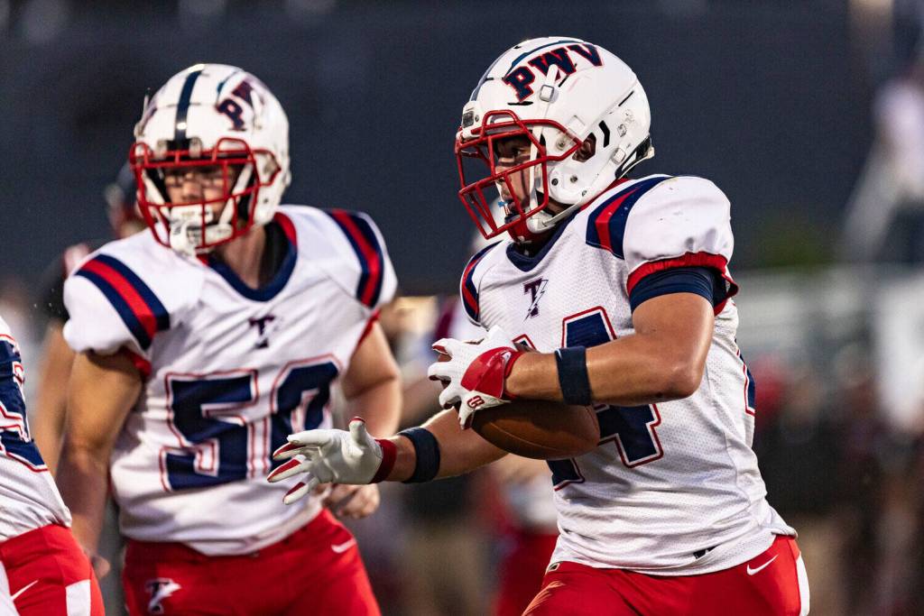 RIDLEY HUDSON / THE CHRONICLE Pe Ell-Willapa Valley lineman Dylan Andrews (50) and running back Lucas Lusk, seen here in a file photo, will face Raymond-South Bend in a Pacific County rivalry game on Friday in South Bend.