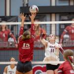 PHOTO BY FOREST WORGUM Montesano middle blocker Violet Prince (11) attempts a spike against Hoquiams Piper Stankavich (13) during the Bulldogs 3-0 win on Tuesday in Hoquiam.