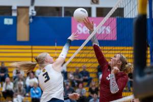 PHOTO BY FOREST WORGUM Aberdeen middle blocker Dallyn Williams (3) jousts with W.F. Wests Vivy Witchey during the Bobcats 3-0 win on Thursday in Aberdeen.