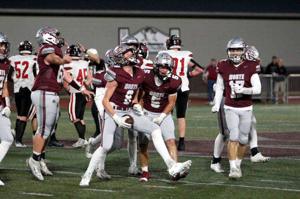RYAN SPARKS | THE DAILY WORLD Montesano defensive end Mason Fry (8) and his teammates are ecstatic after Fry recovered a fumble in the first quarter of a 49-0 drubbing of Tenino on Friday in Montesano.