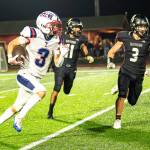 PHOTO BY MATT RUMBLES Pe Ell-Willapa Valleys Blane King (3) looks for a lane while Raymond-South Bends Manny Becerra-Souza (3) and Adam Mora pursue during the Titans 41-6 victory on Friday at South Bend High School.