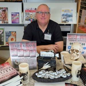 Michelle Traer / Ocean Shores Public Library 
The author at his table at the Ocean Shores Public Librarys third annual authors fair.