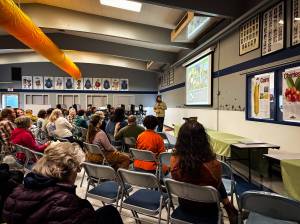 Kyndra Burkland / For The Daily World 
Keynote speaker Noah Siegel gives a presentation at the Quinault Rainforest Mushroom Festival.