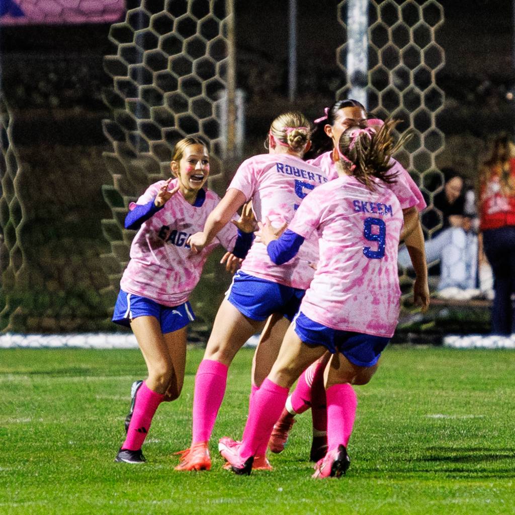 PHOTO BY MIKE ROBERTS Elmas Chelsea Plata (left) celebrates scoring a goal with her teammates during the first half of a 4-1 loss to Montesano on Thursday at Elma High School.