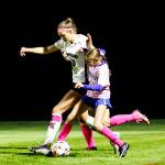 PHOTO BY MIKE ROBERTS Montesanos Mikayla Stanfield (left) and Elmas Chelsea Plata compete for possession the Bulldogs 4-1 win on Thursday at Davis Field in Elma.