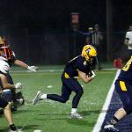 RYAN SPARKS / THE DAILY WORLD 
Aberdeen running back Sam Schreiber (middle) scores a touchdown during the Bobcats 50-20 victory over Centralia on Friday in Aberdeen.