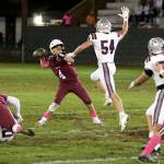 RYAN SPARKS / THE DAILY WORLD 
Hoquiam quarterback K.J. McCoy (4) has his pass blocked by Montesano linebacker Carson Wisdom during the Bulldogs 62-0 win on Friday in Hoquiam.