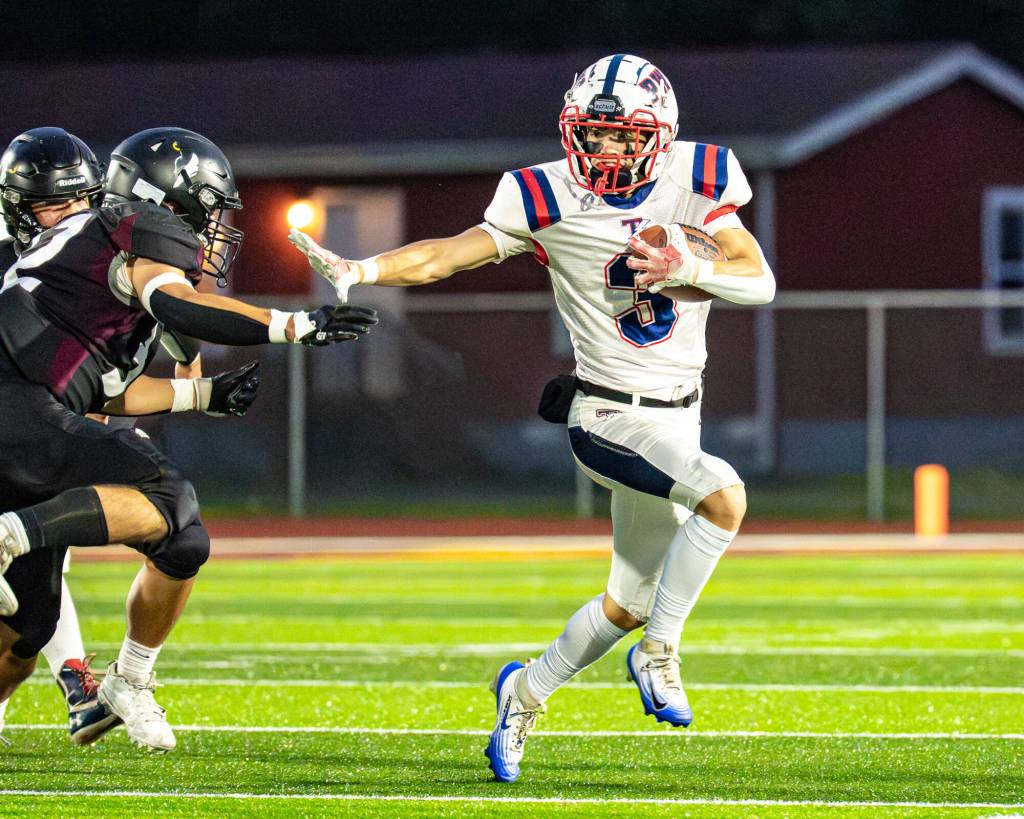 PHOTO BY MATT RUMBLES 
Pe Ell-Willapa Valleys Blane King (3) runs away from the Raymond-South Bend defense in a game on Oct. 4. The Titans face Forks on Friday.