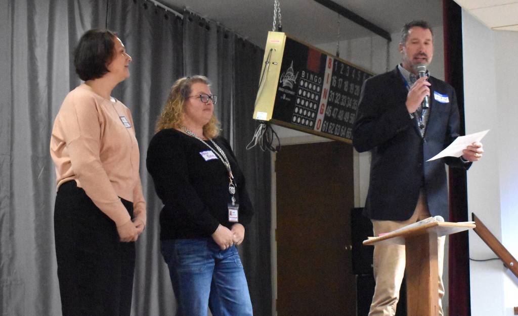 Marchs awardees, Harbors Home Health & Hospice, represented by David Quigg, Angie Brown and Erin Swint (left), update the audience regarding the donation they received.