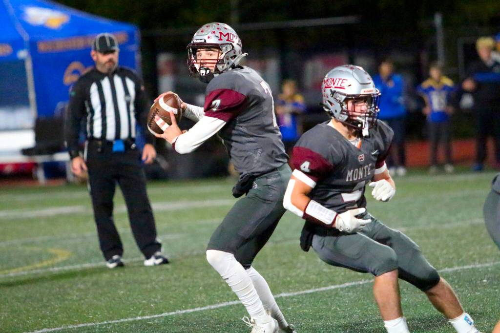 RYAN SPARKS | THE DAILY WORLD Montesano quarterback Tyson Perry (left) looks to pass while running back Zach Timmons blocks during a 22-14 win over Rochester on Friday in Montesano.