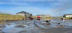 Jana LaRocca
Waves at Damon Point in Ocean Shores Tuesday sent people scrambling as debris slammed into the shore and into the street.