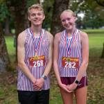 PHOTO BY FOREST WORGUM 1A Evergreen League cross country individual champions: Montesanos Benjamin Anderson (left) and Kamille Vandevender.