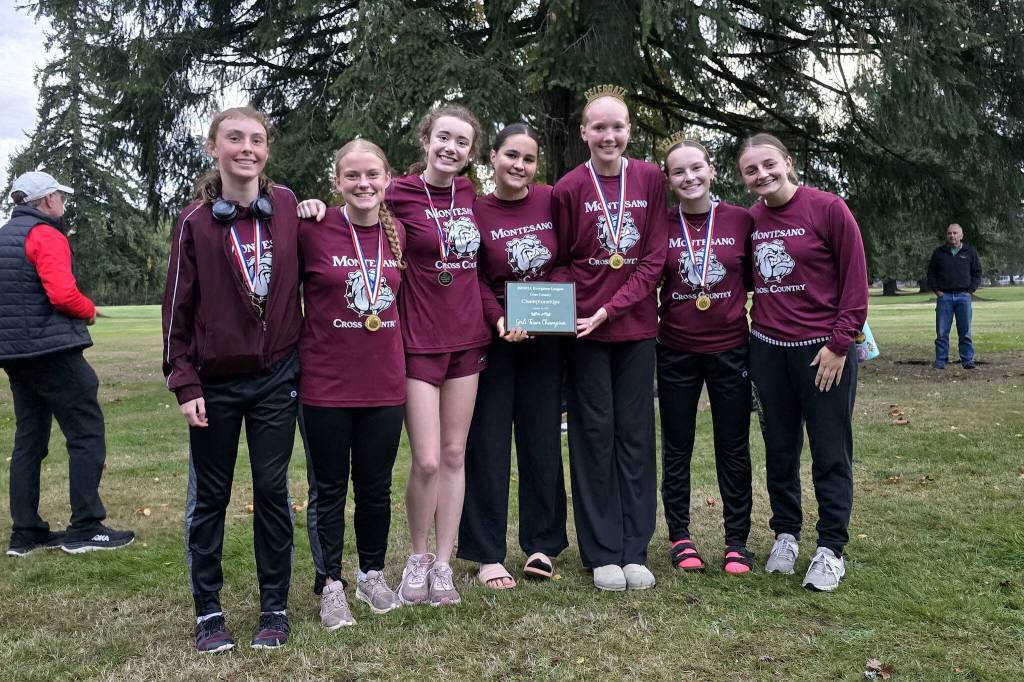 RYAN SPARKS | THE DAILY WORLD The Montesano girls cross country team (from left) Samantha Lubinus, Emily Anderson, Alice Nelson, Sofia Penjakova, Kamille Vandevender, Zoe Ray and Anna OConner won the 1A Evergreen League team title at the 1A Evergreen League Championships on Thursday at the Oaksridge Golf Course.