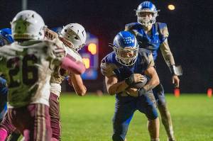 PHOTO BY FOREST WORGUM Elmas Kolby Rademacher (right) scores the game-winning touchdown during a 13-9 victory over Hoquiam on Friday at Davis Field in Elma.