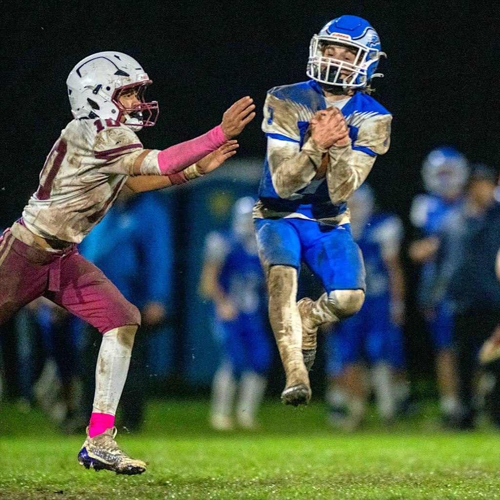 PHOTO BY FOREST WORGUM Elmas Jaxon Brookins (right) intercepts a pass against Hoquiams Javonni Koth to secure a 13-9 victory over Hoquiam on Friday at Davis Field in Elma.