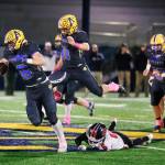 ERICA MCCRORY | MCCRORY PHOTOGRAPHY Aberdeens Micah Schroder (left) breaks through the Tenino defense trailed by teammate Riley Wixson (11) during a 33-20 victory on Thursday at Stewart Field in Aberdeen.