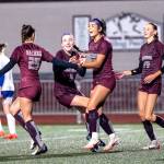 PHOTO BY FOREST WORGUM Montesanos Lizzy Kolar (25), Ashley Hill (3), Jaelyn Butterfield and Haley Schweppe (44) celebrate a goal during the Bulldogs 8-0 win over Rochester in a 1A District 4 Tournament semifinal game on Thursday at Montesano High School.