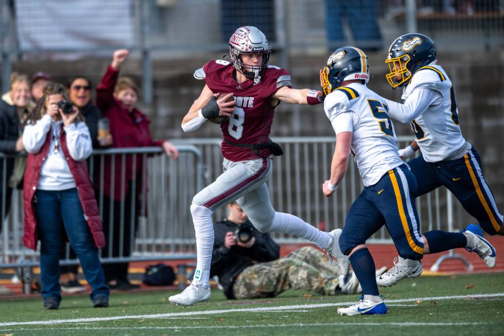 PHOTO BY FOREST WORGUM Montesano defensive end Mason Fry (8) scoops up a fumble during the Bulldogs 48-0 win over Annie Wright Academy in a 1A state-qualification game on Saturday at Montesano High School. Montesano forced six turnovers in the game.