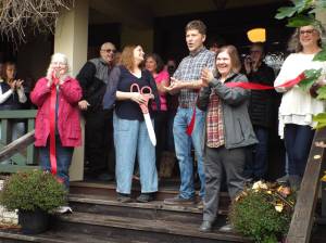 Andrea Watts / The Daily World 
Before Lorena Maurer did the honors of cutting the ribbon, Matthew Maurer addressed the attendees. Wed like to say thank you to the community because we have heard nothing but signs of statements of relief and appreciation that we came in and took it up in the spirit of Penny and Everett to keep the restoration going. And we would also like to thank everybody that has helped out. Our friends and family, everybody that showed up today. Thank you so much for being here.