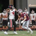 PHOTO BY FOREST WORGUM 
Montesano defender Ashton McKinney (22) applies pressure to Tenino quarterback Mason Metcalf during the Bulldogs 49-0 win on Oct. 3. The two teams square off in a 1A State Tournament game on Saturday at Jack Rottle Field in Montesano.