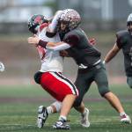 PHOTO BY FOREST WORGUM Montesano defender Carter Smith (right) tackles a Tenino ball-carrier during a 49-7 win over Tenino in a 1A State Tournament first-round game on Saturday at Jack Rottle Field in Montesano.