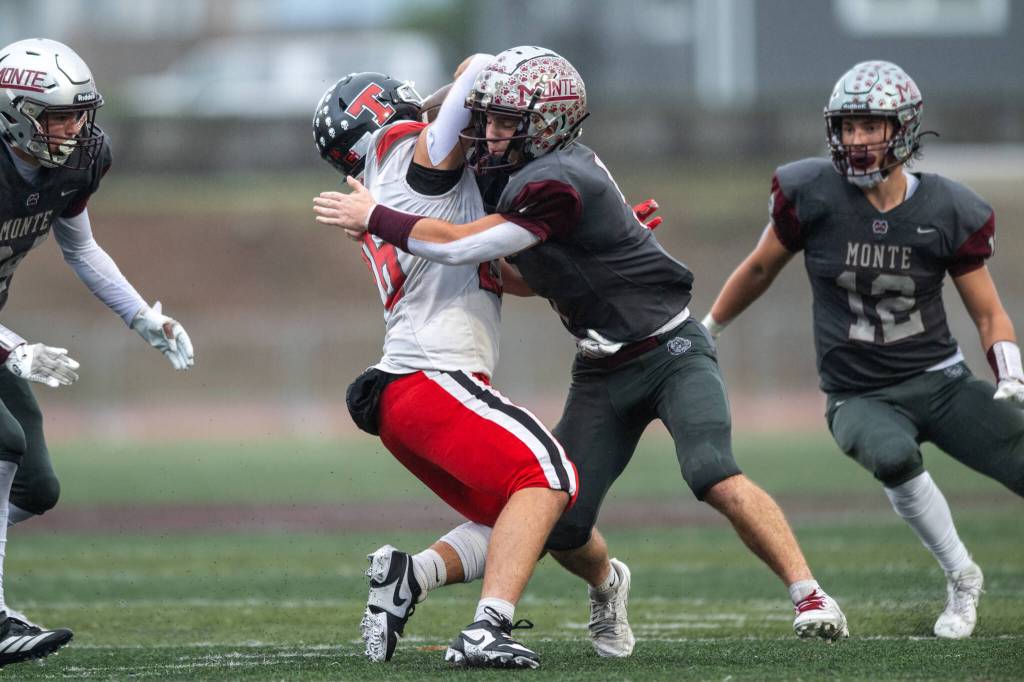 PHOTO BY FOREST WORGUM Montesano defender Carter Smith (right) tackles a Tenino ball-carrier during a 49-7 win over Tenino in a 1A State Tournament first-round game on Saturday at Jack Rottle Field in Montesano.