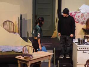 At the beginning of Act 2, Jasmine Jo Lock (Anne Frank) and David Bennett (Mr. Dussel) exchange words.