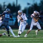 PHOTO BY FOREST WORGUM Montesano running back Terek Gunter (middle) runs the ball during a 56-35 loss to Lynden Christian in a 1A State Tournament quarterfinal game on Saturday at Blaine High School.