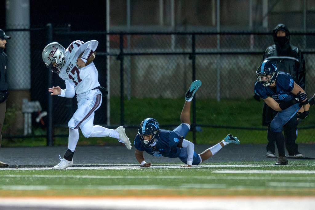 PHOTO BY FOREST WORGUM Montesanos Terek Gunter (17) tip-toes down the sideline en route to a 90-yard kickoff return touchdown during a 56-35 loss to Lynden Christian in a 1A State Tournament quarterfinal game on Saturday at Blaine High School.