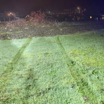 Tire tracks lead toward the Hoquiam River.