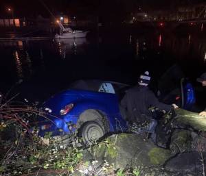 Hoquiam Police Department photos
A Chrysler PT Cruiser hangs just feet from entering into the Hoquiam River.