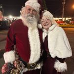 Santa and Mrs. Claus pose for a photo at the Ocean Shores Christmas tree lighting event.