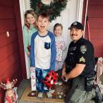 The Daily World file photo
Sgt. Stephen Heller helps distribute toys during last years Grays Harbor County Sheriffs Department Holiday Toy Drive.
Sgt. Stephen Heller helps distribute toys during last years Grays Harbor County Sheriffs Department Holiday Toy Drive. (The Daily World file photo)
