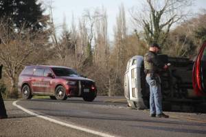 Jeff Clemens
Pacific County Sheriffs Office Sgt. Kyle Pettit speaks with a firefighter about the collision that occurred near Hammond Rd on State Route 105 outside of Raymond.