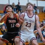 PHOTO BY FOREST WORGUM Montesanos Caden Grubb (23) competes for a rebound against Centralias Alfonso Villalba during the Bulldogs 69-57 victory on Monday in Montesano.