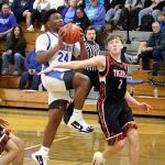 RYAN SPARKS | THE DAILY WORLD Elmas Tyrone Aguilar (24) drives to the rim against Centralias Trevor Griffis during the Eagles 66-56 victory on Tuesday at Elma High School.
