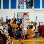 NICOLE SHANNON | MAIN FOCUS MEDIA Elma senior Isaac McGaffey (3) drives to the hoop to score two of his game-high 23 points during the a 66-56 win over Centralia on Tuesday at Elma High School.