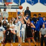 NICOLE SHANNON | MAIN FOCUS MEDIA Elmas Dylan Myer (13) grabs a rebound against Centralias Braden Baine during the Eagles 66-56 victory on Tuesday at Elma High School.